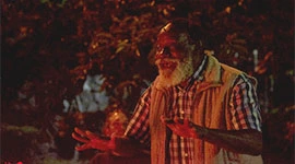 Community elder mentor performs storytelling